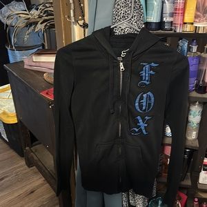 Black with blue FOX logo, size small zip up sweatshirt